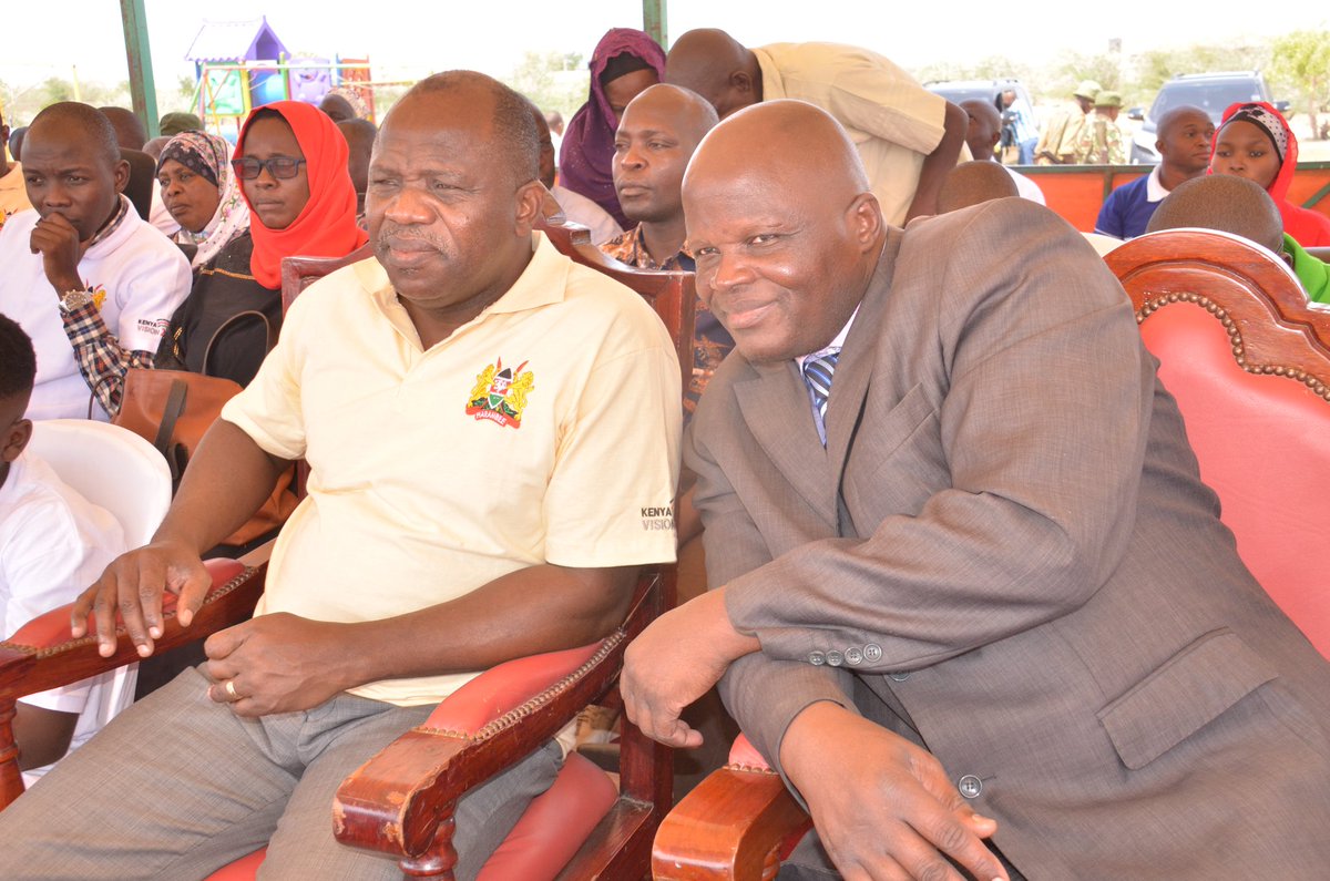 Tana River Gov. Dhadho Gaddae Godhana consults with Mr. Ngei Mutinda, a Senior Deputy Secretary in the Ministry of Labour and Social Protection, during celebrations to mark   #thedayoftheafricanchild .The celebrations were held at the Catholic Vocational Training Centre in Hola.