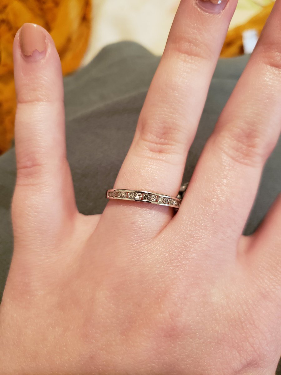 wendigochild13's tweet photo. Well last night, Bobby proposed to me. We went on a drive, and he proposed out at Skeleton's Lair, it's a haunted house we both worked at and that's where we met. This is the temp ring and it's still too big, so it's on my necklace right now. @ZombyGamr https://t.co/fDI3BZh9p4