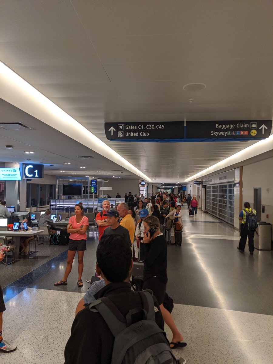 M_bhill's tweet photo. Meanwhile , my bags , kids car seats are where ??? Can't go look because I have to wait in line. #UnitedAirlines  I'm not here for the weather excuse . Forecast clearly showed lightning , proactive flight changes should have been offered. https://t.co/VEN3odb0J2