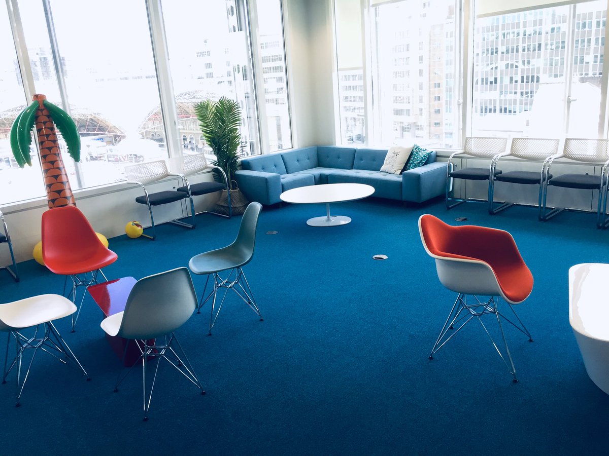 Google breakout space with sofas, chairs and palm trees