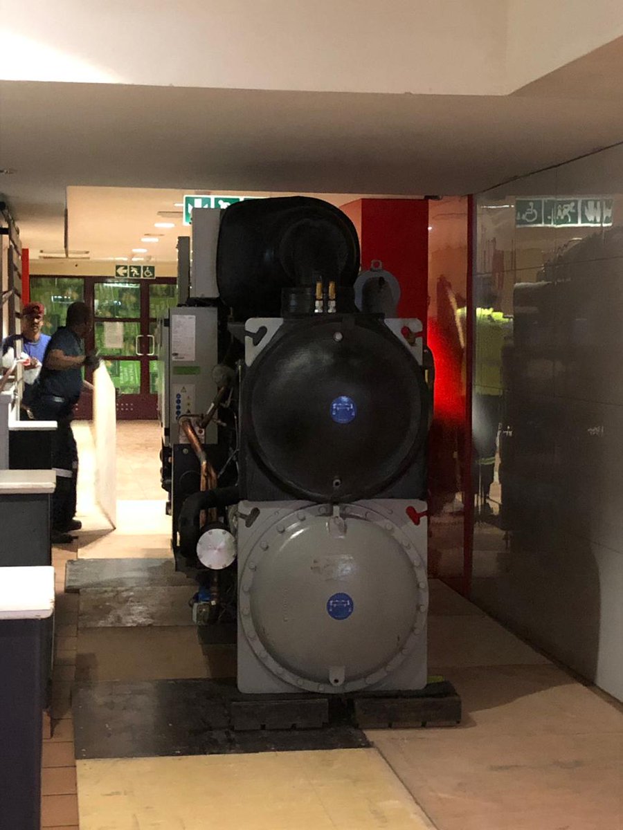 Is it a locomotive?! No! It's a chiller being moved past the Spar in the Neelsie, part of the new Neelsie district cooling plant. <a href="/MatieBuilder/">Facilities Management Stellenbosch Uni</a>  <a href="/turnertownsend/">Turner & Townsend</a>