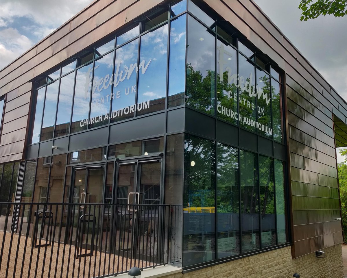 White cut #vinyl lettering onto external face of glass, for Freedom Centre UK #throwback #wideformatprinting