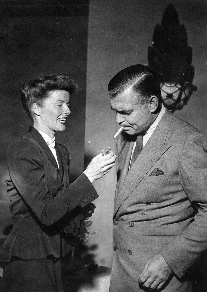 Katharine Hepburn lights one for Clark Gable