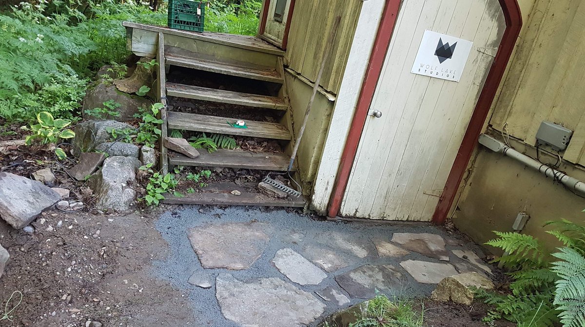 WolfLakeStudios's tweet photo. J-P and Alex built a new path for the studio entrance this past weekend. Looking awesome! #studioupgrades #needsashrubbery @jpvansadek @GalleyProds https://t.co/DH2lmwZRc4