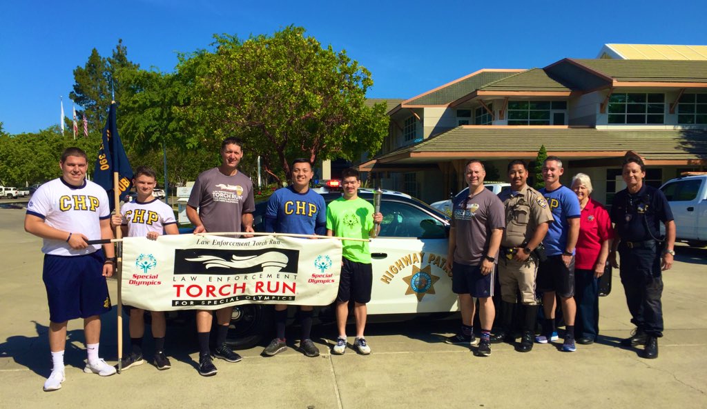 CHPDublin's tweet photo. CHP along with @LivermorePolice , and members of @CityofLivermore carried the Flame of Hope through @livedowntown to hand it off to Easf Bay Regional Parks Police. Ryan from @SONorCal @LETRforSO @SpecialOlympics lead the way. So inspirational! https://t.co/t3sHaDpDof
