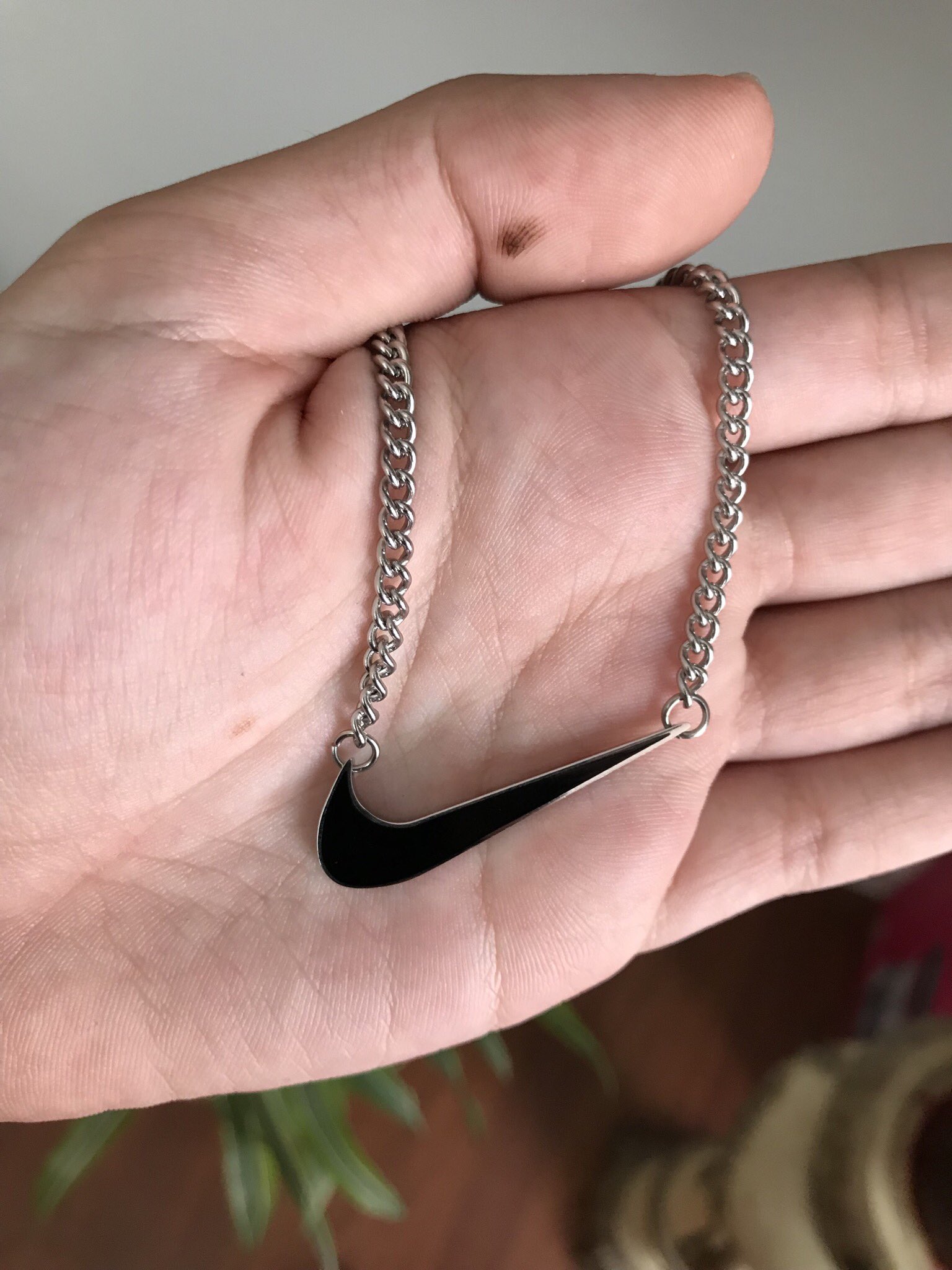 nike swoosh pendant