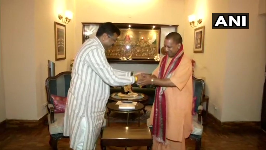 ANI's tweet image. Uttar Pradesh Chief Minister Yogi Adityanath meets Union Minister Dharmendra Pradhan in Delhi.