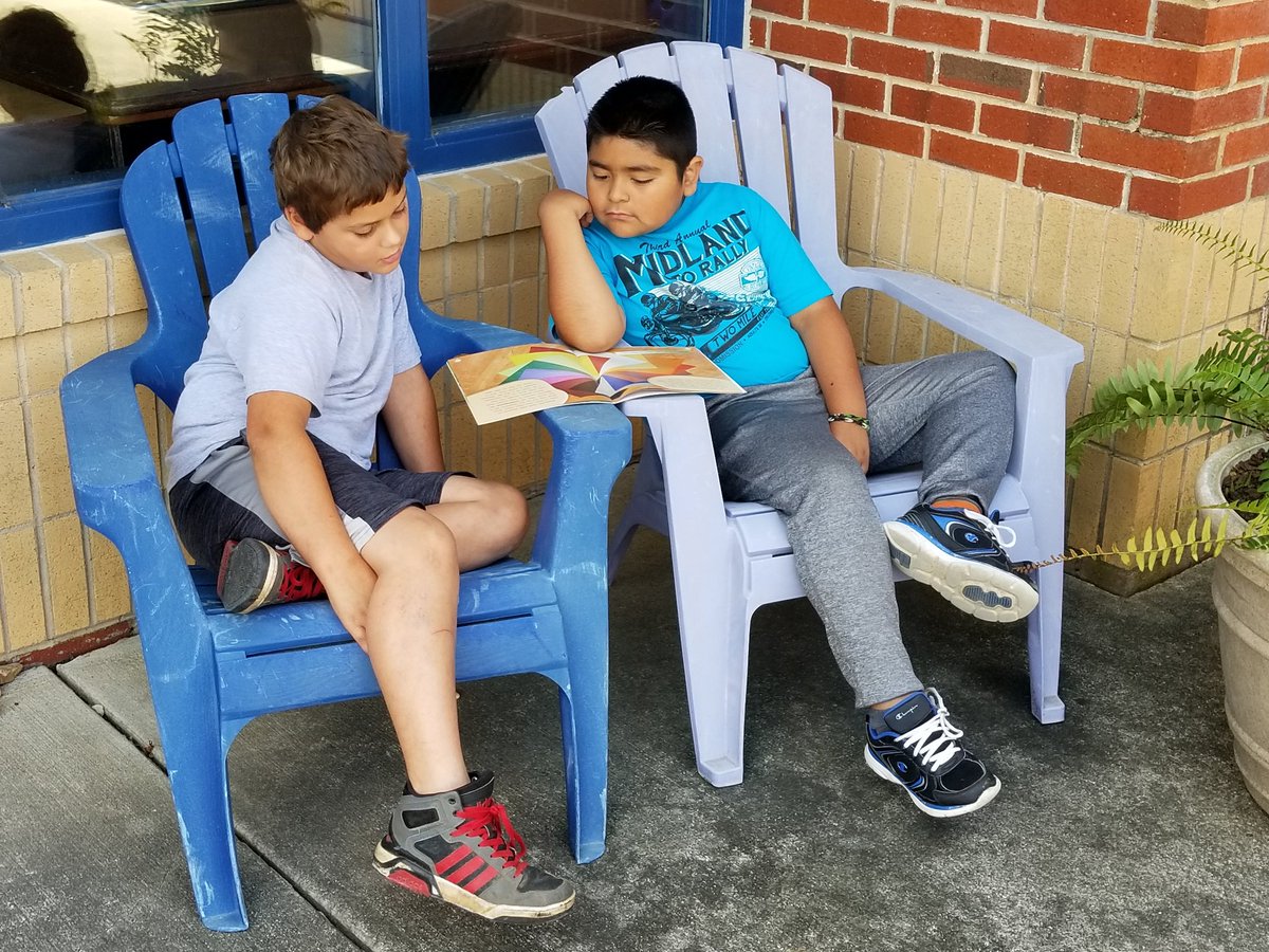 It's a beautiful day to read outside with a friend! #VCSBetterTogether #readtoachieve #readingcamp