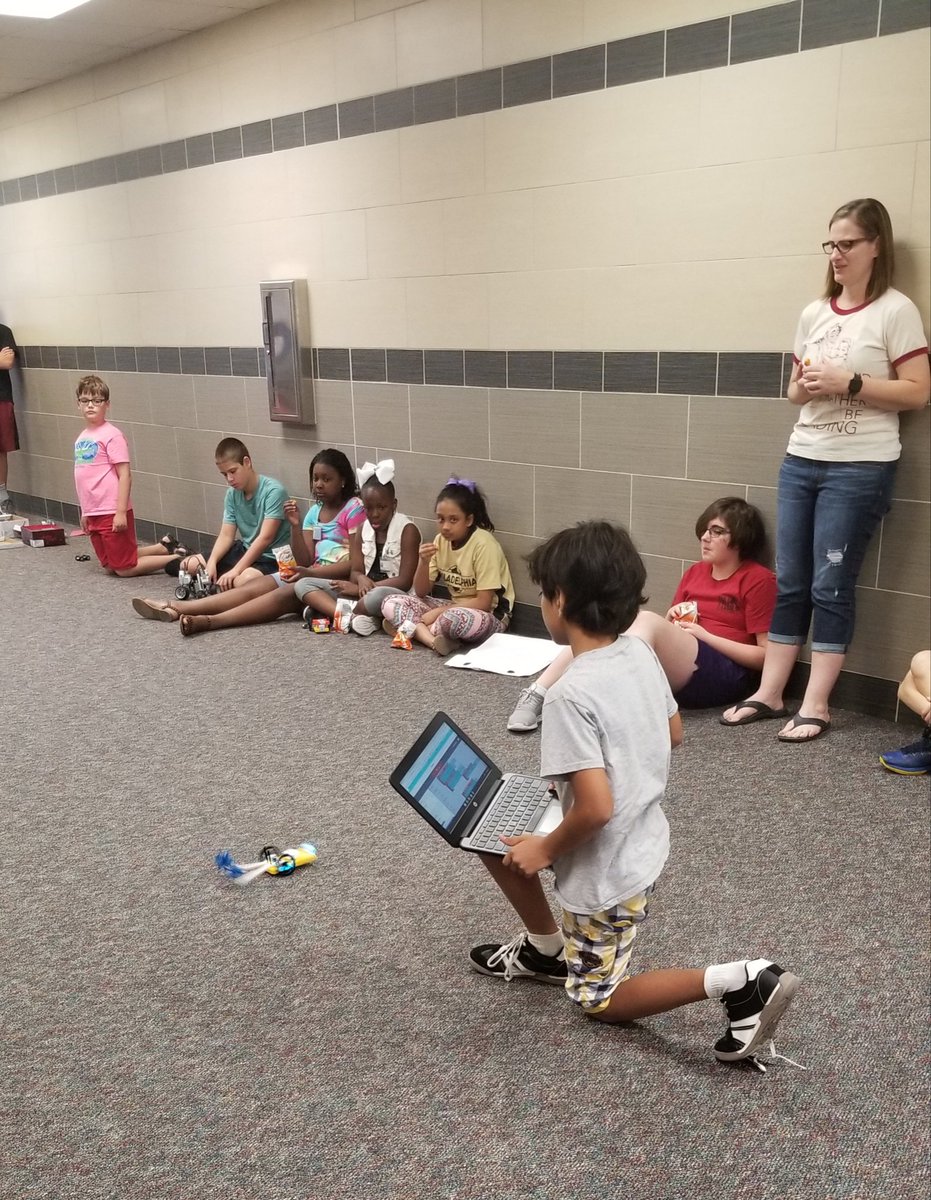 TCodecamp's tweet image. Students showcasing their work at coding camp.