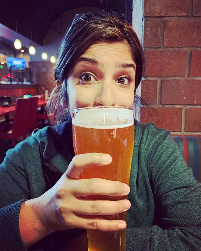 BeerocratsTV's tweet photo. Beerocrat @zareena83 with a Tuesday IPA. It’s almost as tall as her... which isn’t saying much because she’s short 😂 https://t.co/mKnL7P7F2H https://t.co/872EoBoiAm