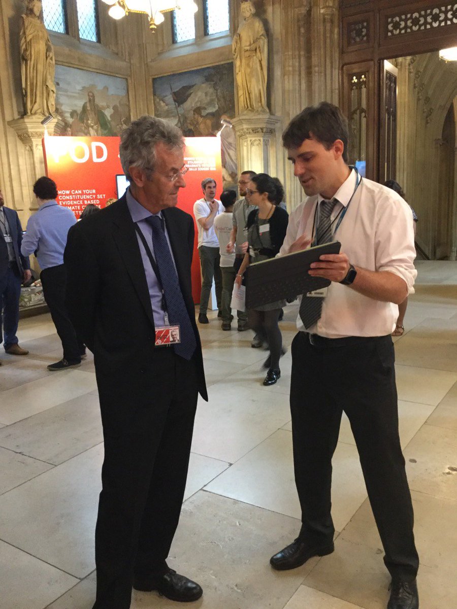 PublicPolicyUoS's tweet photo. Dr @xiao_ba and Dr Enrico Gerding discussing the different technologies around #electricvehicles with Lord Krebs at #EvidenceWeek. Are you around @UKParliament? Visit our #EvidencePod 2 in Upper Waiting Hall and find out more. https://t.co/riXJTcUkjA