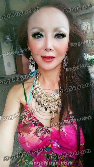 Ange Maya Wore Floral Tropical Skirt in front of a floral fountain. Watch her Qi Dance (Qi Gong Belly<a href="/tag/afm"class="tags"><span>#afm</span></a><a href="/tag/americanfilmmarket"class="tags"><span>#americanfilmmarket</span></a>