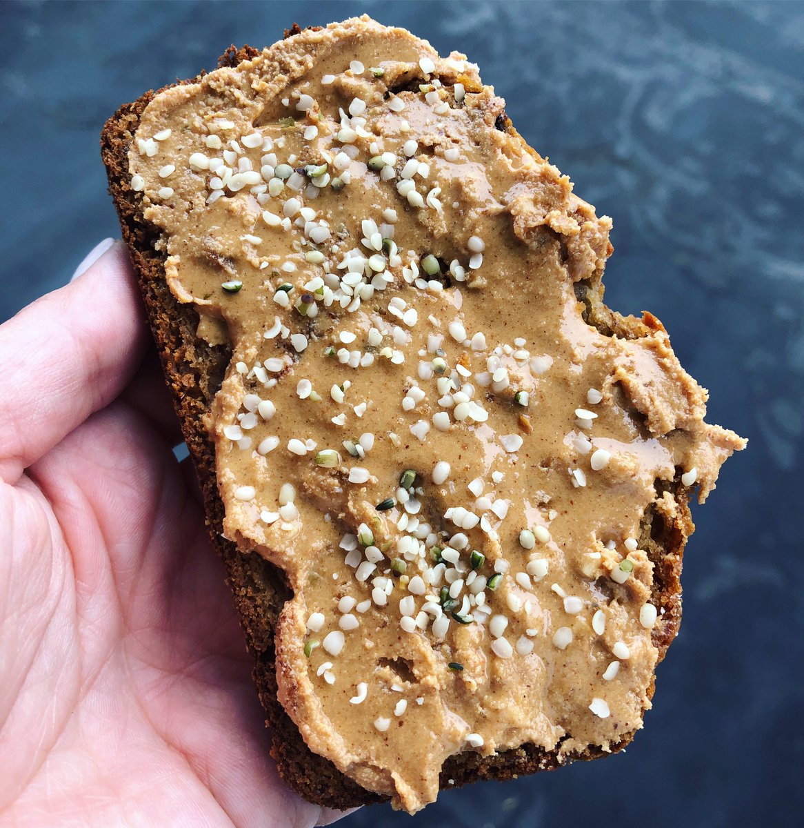 Almond flour banana bread + homemade collagen peanut butter topped with hemp seeds 🥰 simple but so delicious! We are wholesale suppliers of all almonds products from whole to diced to butter. Need almonds? Shoot us a message for more info ❤️ #nuts #seeds