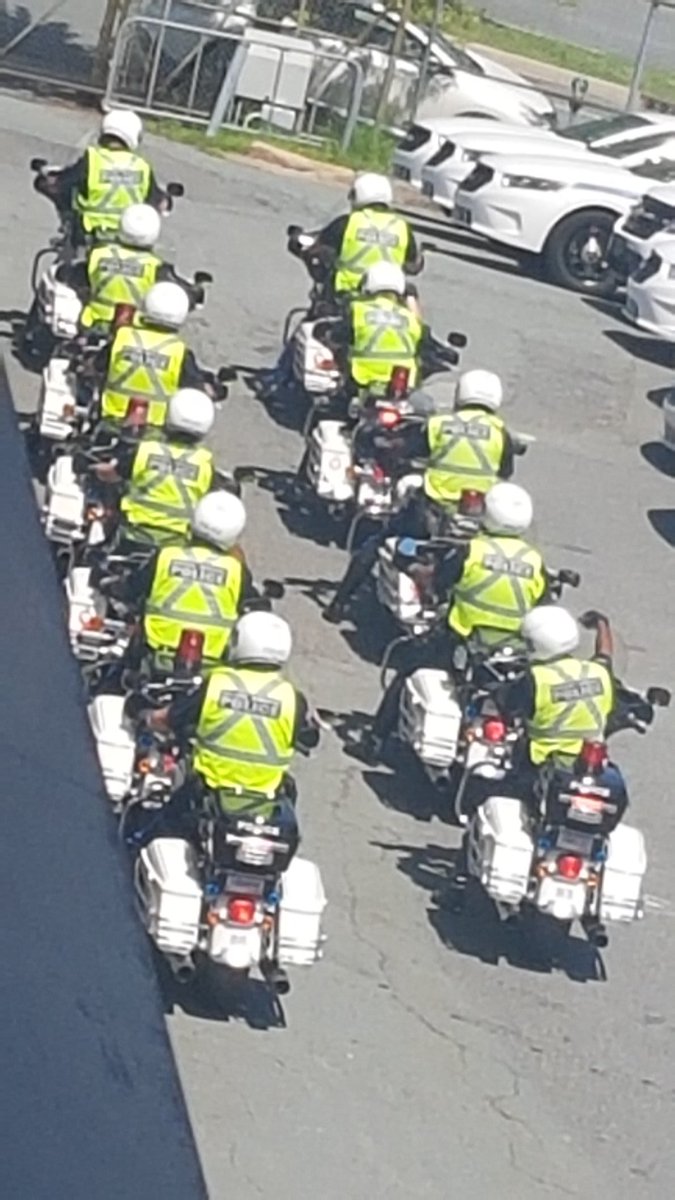 RobinEMcNeil's tweet image. I truly love my job, but the familiar rumble of @HfxRegPolice motorcycles caused me to look out the window to take this photo. I can admit that it is days like today that make me a little envious of @HRPTrafficCop and colleagues #differenttime #policemotorcade #prideinservice