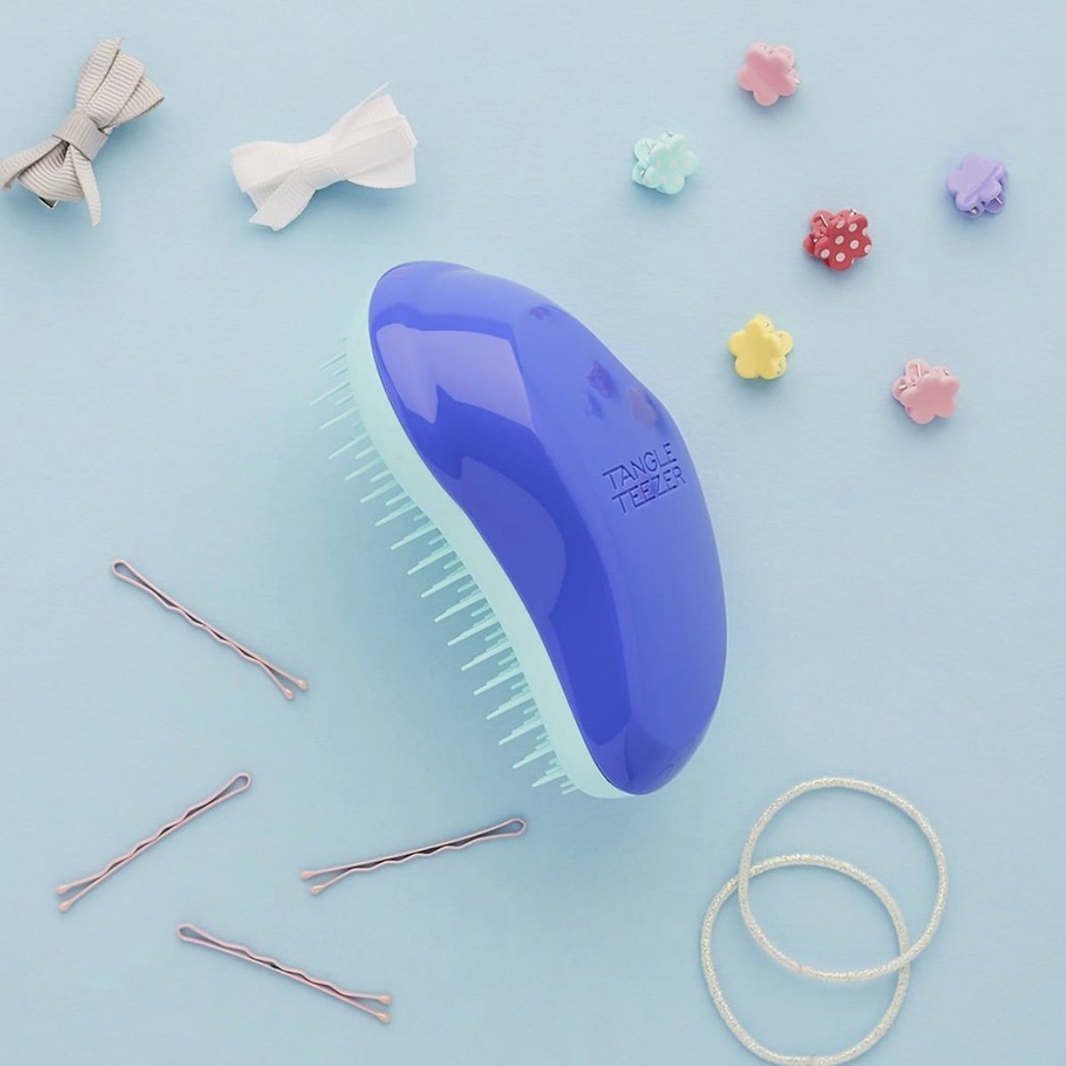 TangleTeezerCan's tweet photo. The Original detangling hairbrush in Electric Purple. What colour is your favourite? https://t.co/v2iatbssY1