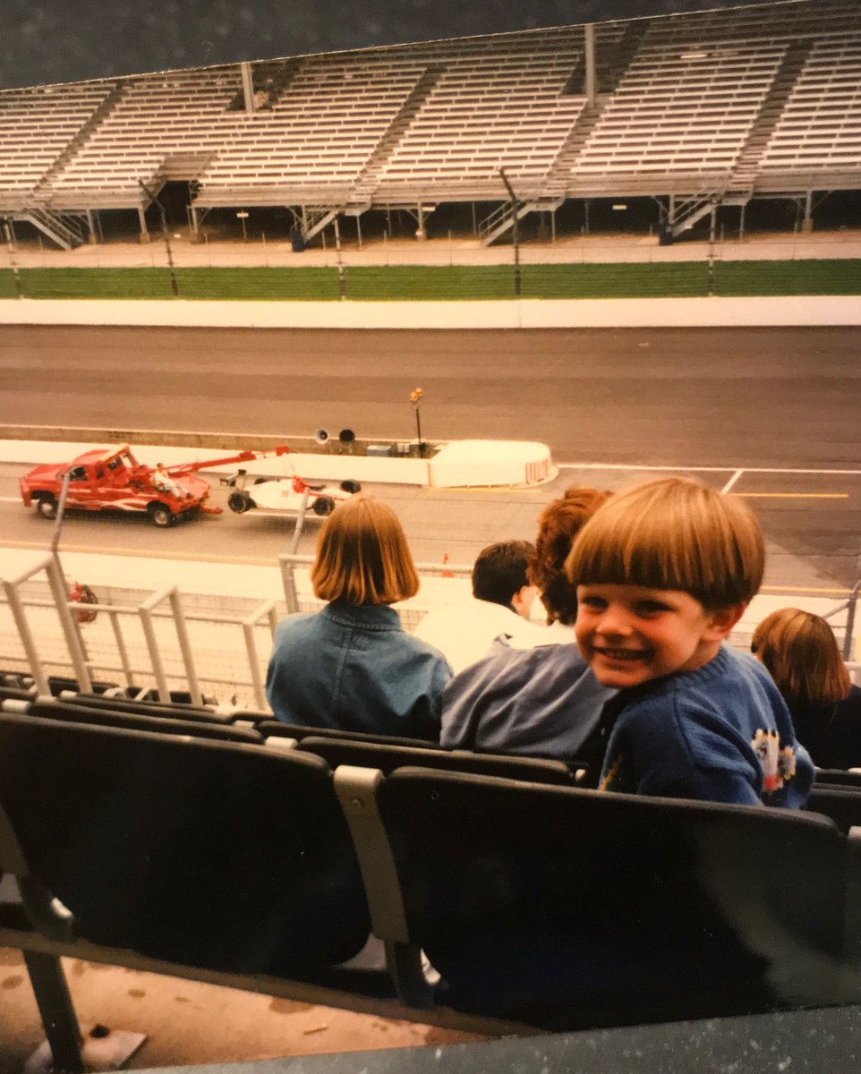 ConorDaly22's tweet photo. Here is your #IndycarTrivia For the day. Can we figure out whose car is on the hook behind a young @IndyCar fan here? I actually don’t know the answer so I’m genuinely curious 😂 mid 90’s-ish #BowlCutSoYouKnowItsMe https://t.co/Z1rnusw4jm