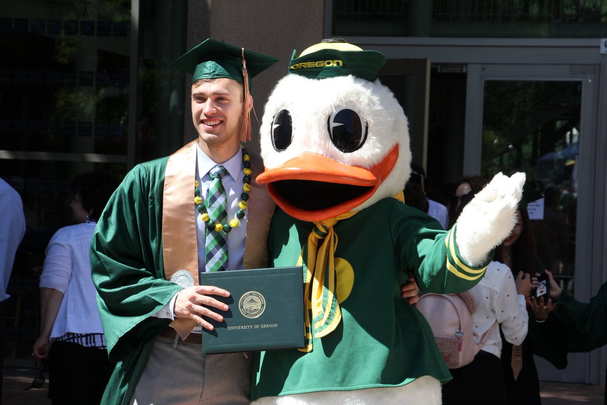 uoregon's tweet photo. It's hard to tell who was happier: The Duck or the graduates. #DuckGrad19 2/2 https://t.co/voVk26dpBr
