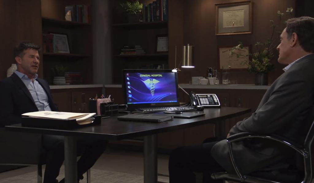 Neil sits across a desk from Kevin in his office at General Hospital. 