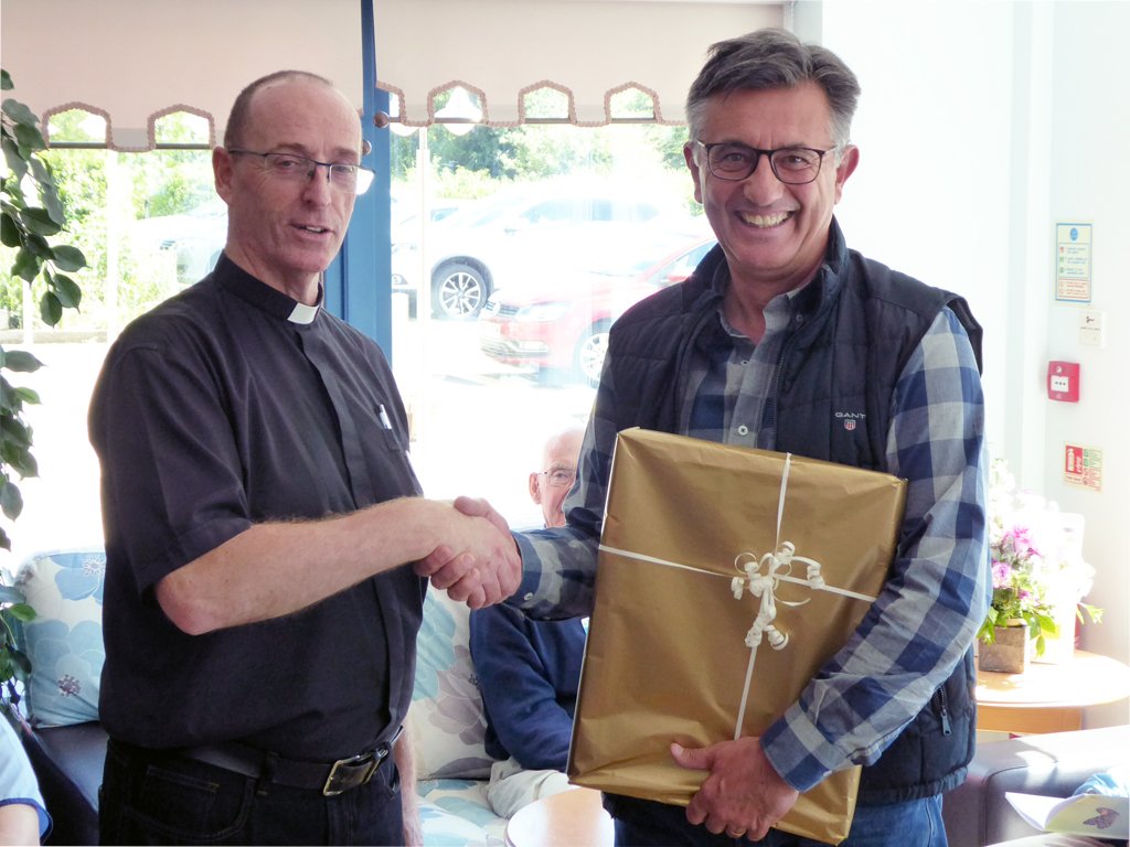 Yesterday we bade a fond farewell to Rev David O'Brien who has been our fabulous chaplain for the last four years. David &amp; family are returning to Lancashire and we wish them all the very best for the future. Here's Mark Thorn presenting Davis with a gift.