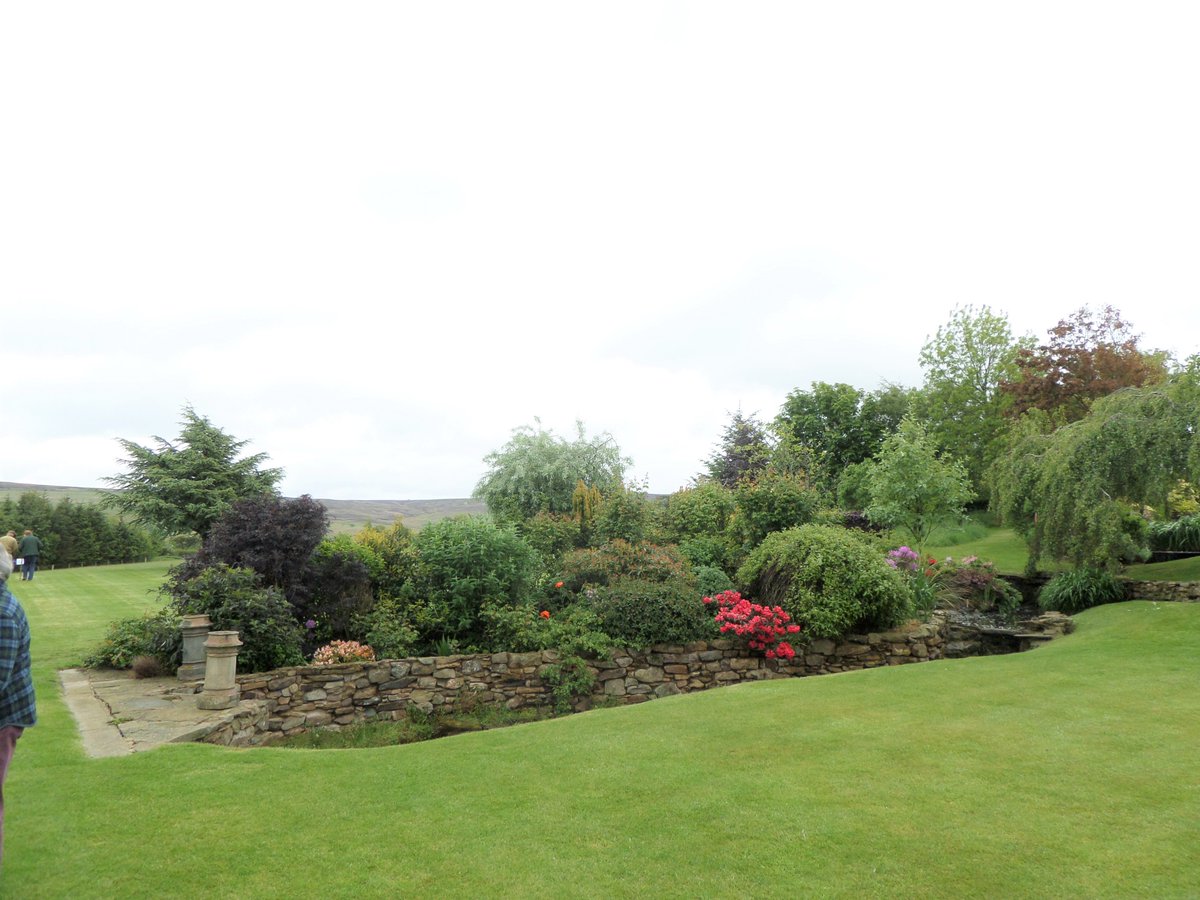 HTrail2019's tweet photo. Our final garden! 900 ft up on the edge of the fell. Roses & lawns, stream & ponds, & the 'peeing cherub', powered by the stream; the water then running down to the #Devilswater. Wheelchair friendly. CAKES! @discovernland @hexhamcourant @TheJournalNews @VisitHexham @GreatN_Land https://t.co/DiU6mPlK5v
