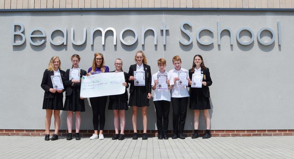 Year 8 Student Leaders present Katie from the @Willow_Fdn the proceeds from our first ever charity #ColourRun. Over £1500 raised! Read about it at: beaumontschool.com/charity-colour… #WillowFoundation #BSfridayPhoto