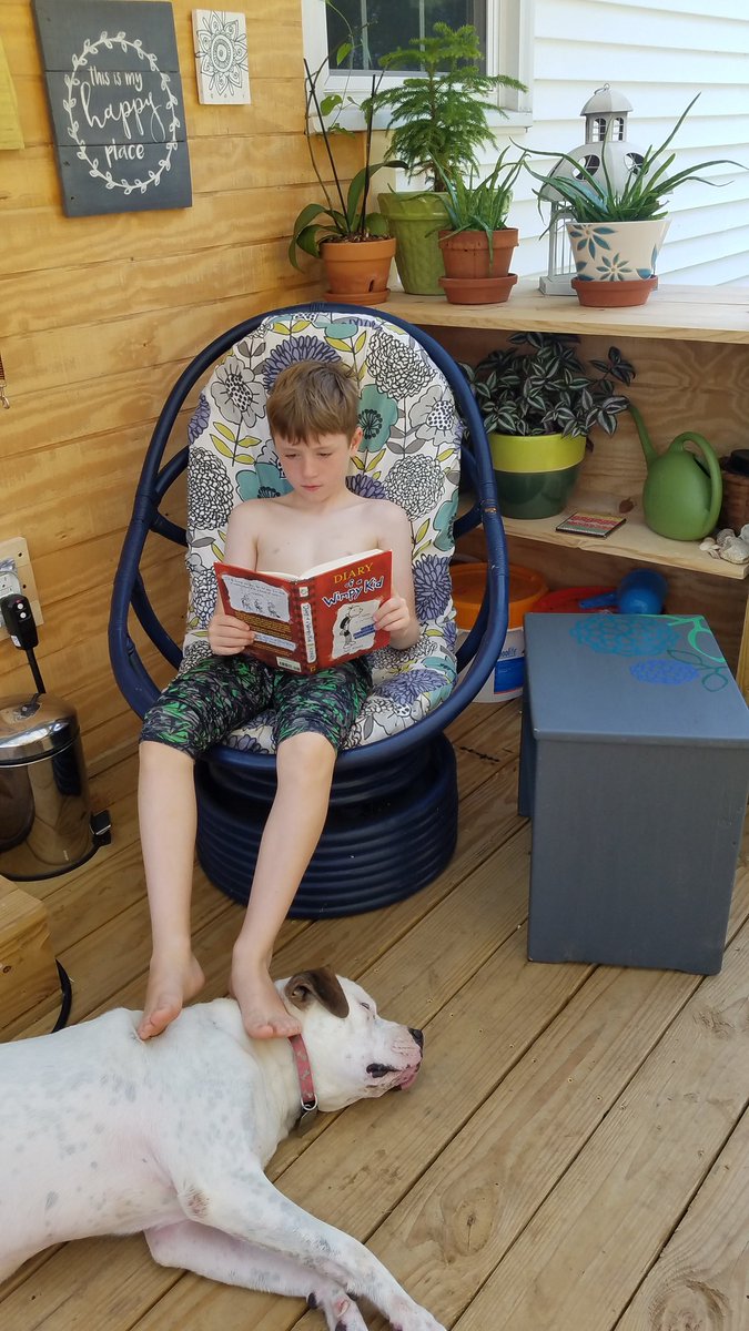 A boy and his dog. And a good book. We're loving our morning reading time. Take your time summer! #JRESreads