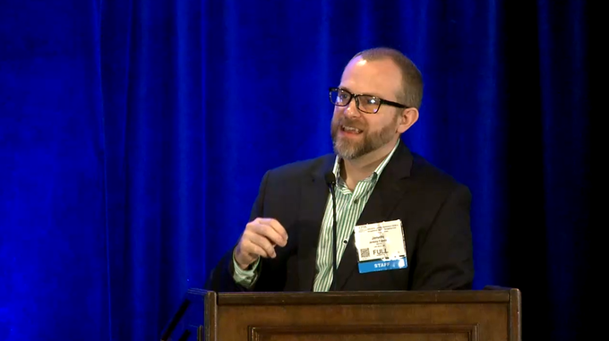 Jeremy Furniss speaks at AOTA's conference.