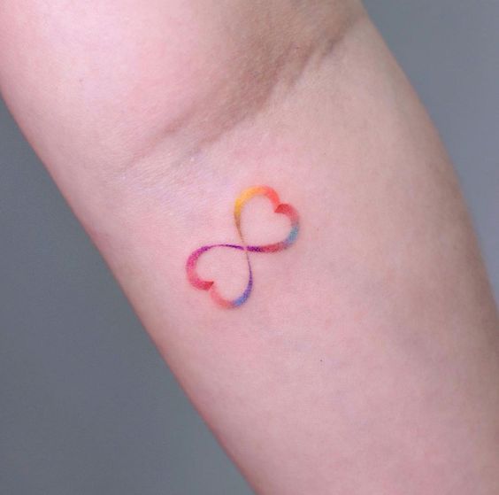 Infinity heart tattoo placed on the ankle minimalistic