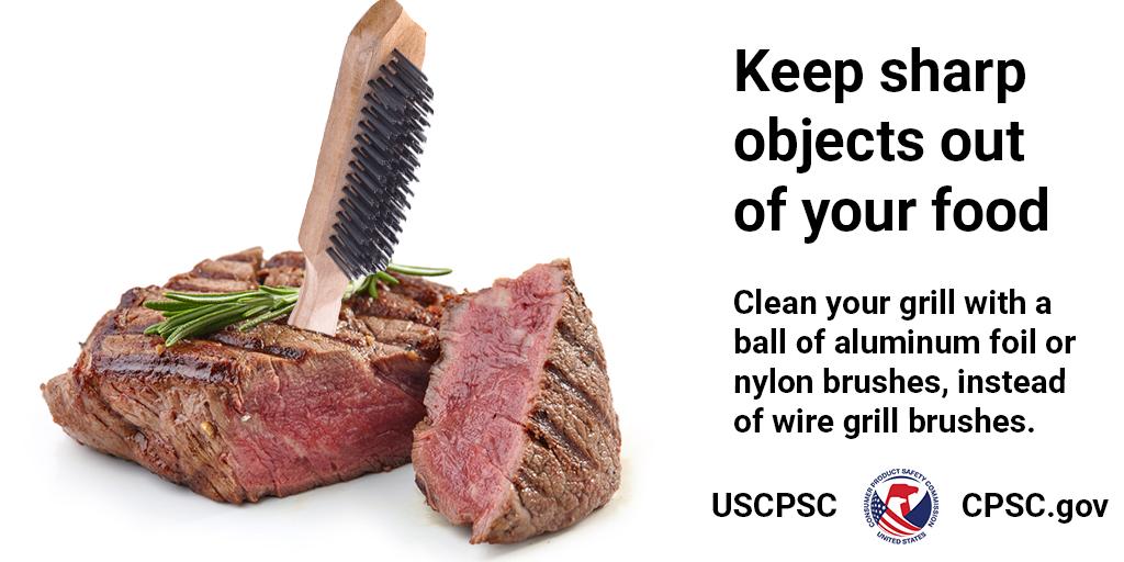 A grill brush sticking out of a steak. The text reads: Keep sharp objects out of your food. Clean your grill with a ball of aluminum foil or nylon brushes, instead of wire grill brushes.