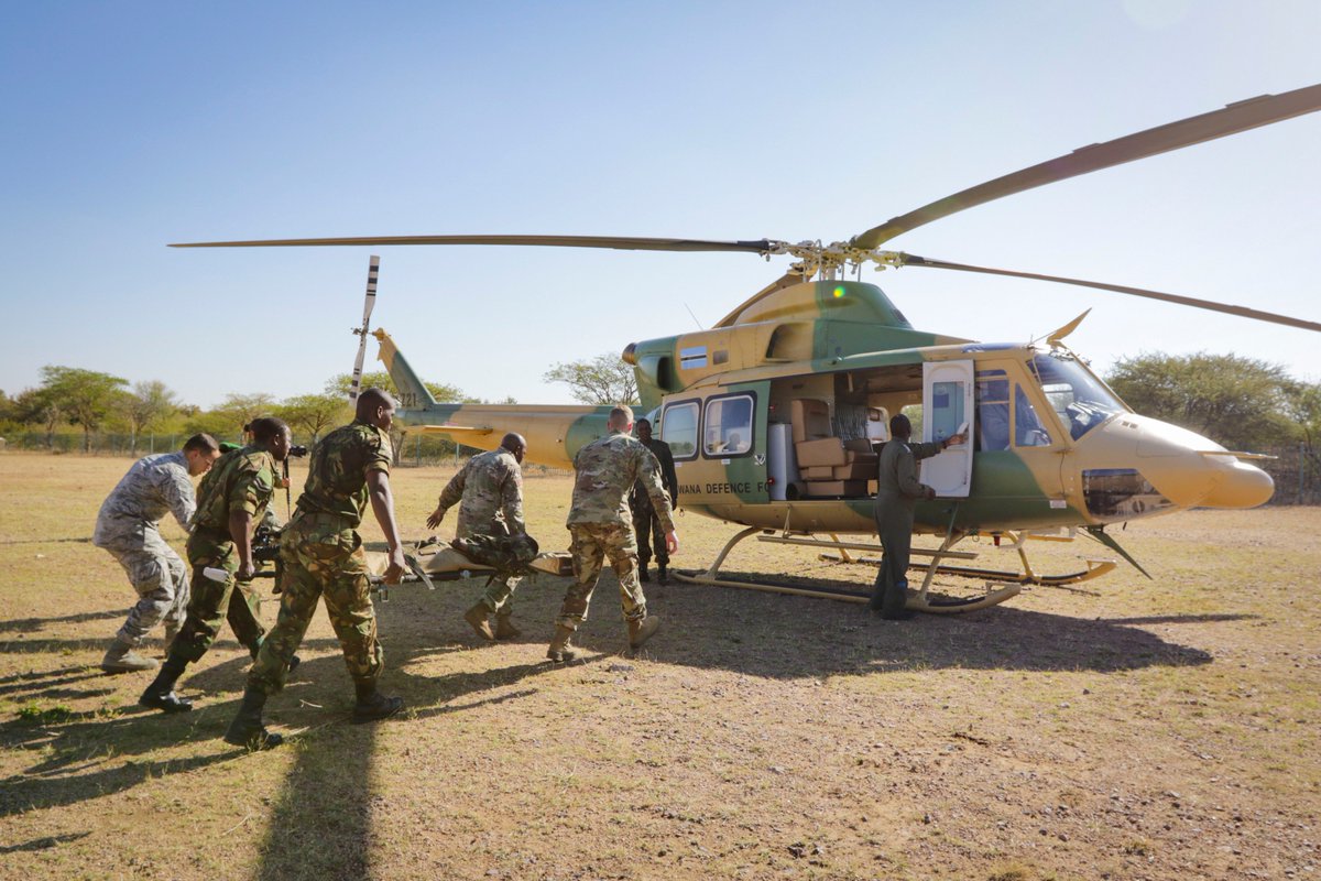 SETAF_Africa's tweet photo. .@USArmy Africa #soldiers, the 773rd Civil Support Team, and the Botswana Defense Force carry a stretcher during a medical evacuation rehearsal during the African Land Forces Summit at the Gaborone International Convention Center, Gaborone, Botswana, June 20, 2019. #ALFS19 https://t.co/UFkxQyn44q