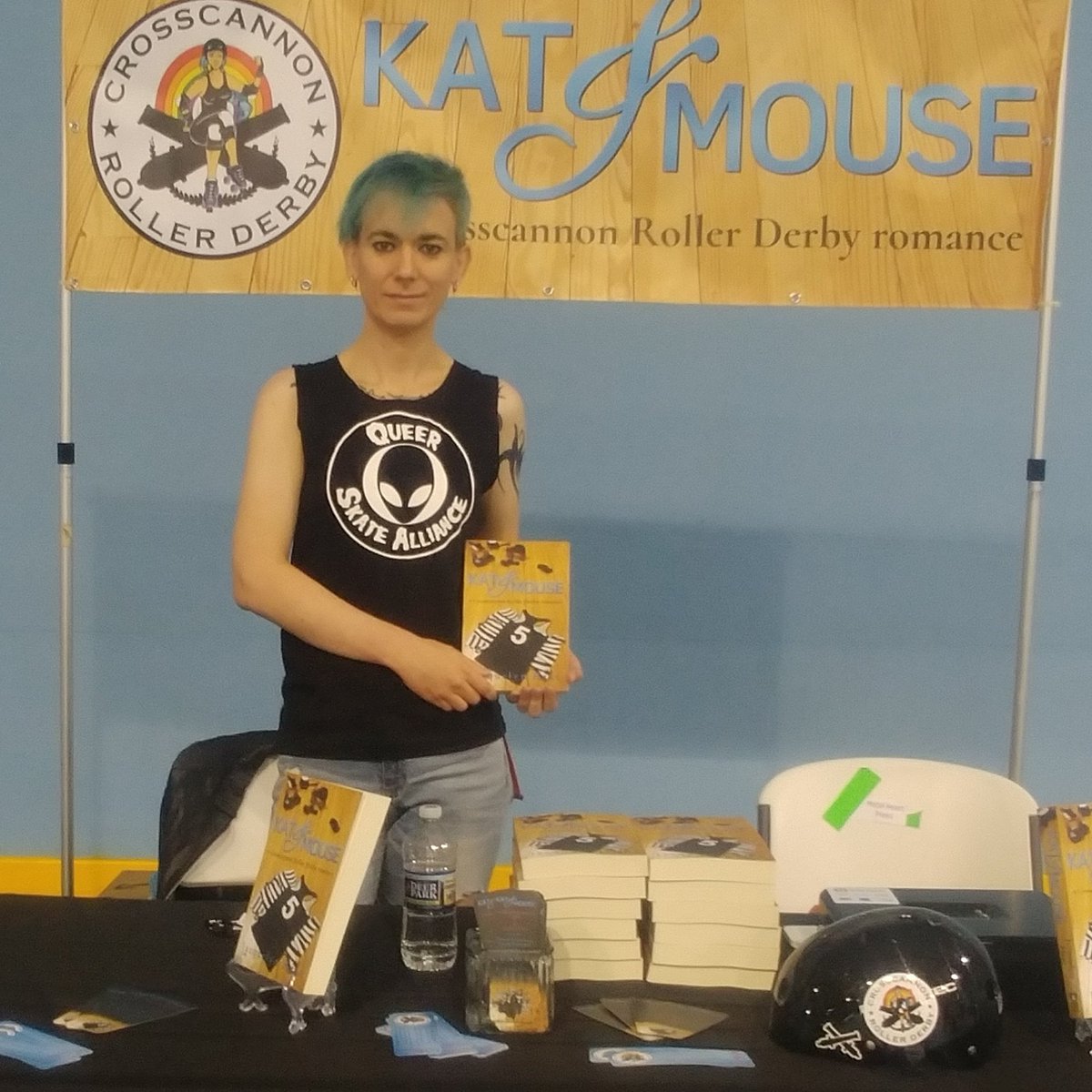 CrosscannonRD's tweet photo. #queerpeer representing at #ECDX2019! Come by Rink 1! @jacquelynheat is selling &amp; signing her queer derby romance novel KAT &amp; MOUSE! #katandmousebook #DerbyTwitter #queerskatealliance https://t.co/bFZjcybVIP