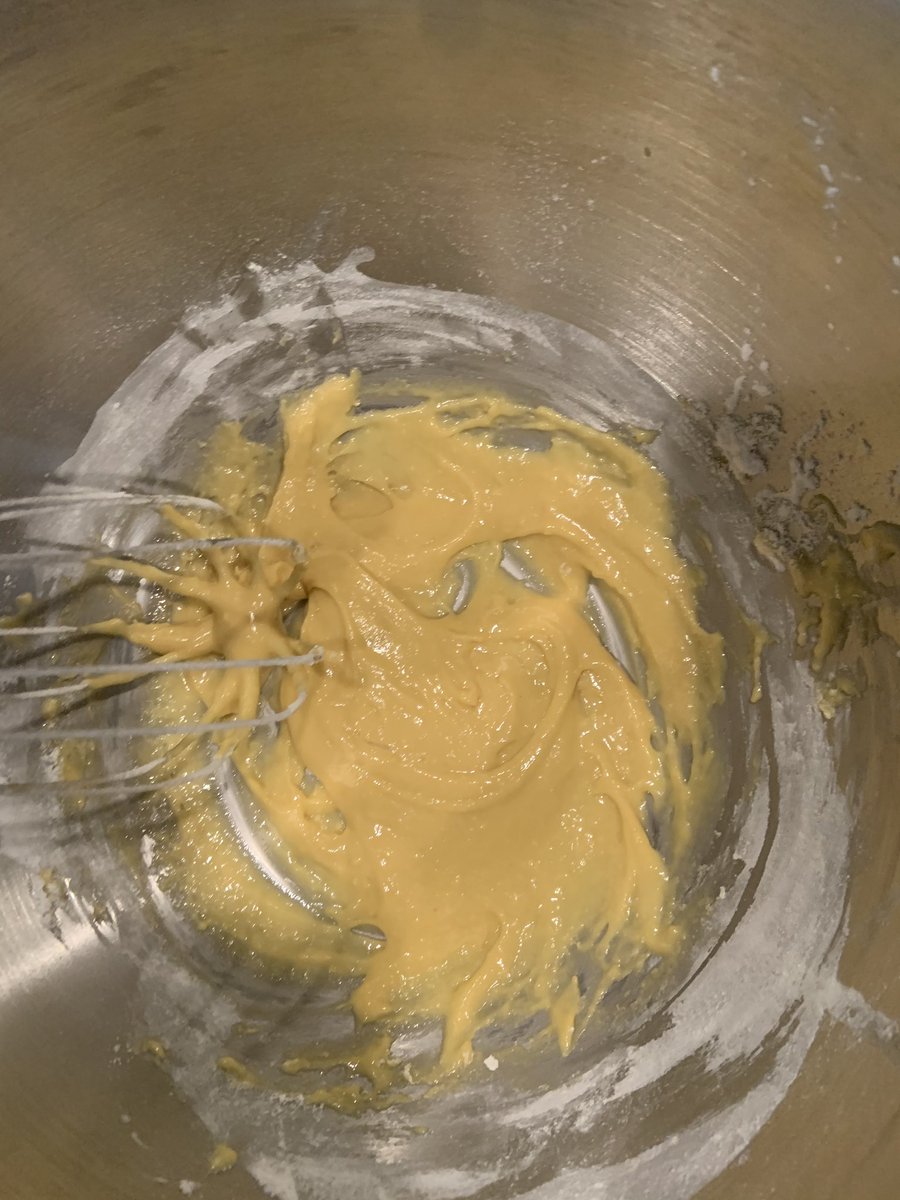 into the egg yolks add flour balking powder milk and vanilla and whisk until incorporated