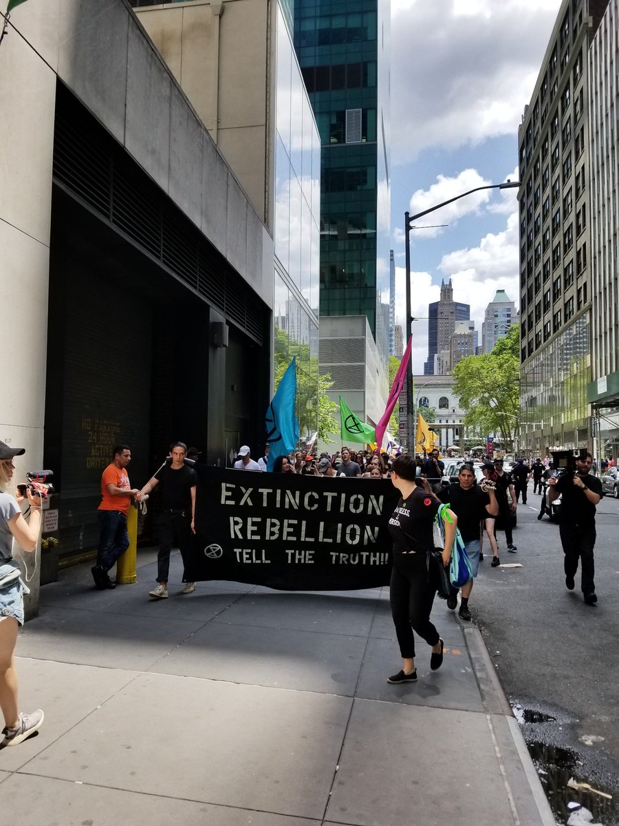 AlexandriaV2005's tweet photo. Today @XR_NYC had 70+ arrests at their #EarthToMedia protest at the @nytimes! They blocked 8th Av, died-in, &amp; 5 ppl repelled the NYT &amp; Port Authority bldgs to drop banners &amp; demand climate coverage! So excited @Earth_Uprising continues this theme on 6/28 for #ClimateStrikeSummer! https://t.co/SGMu8ofxkF