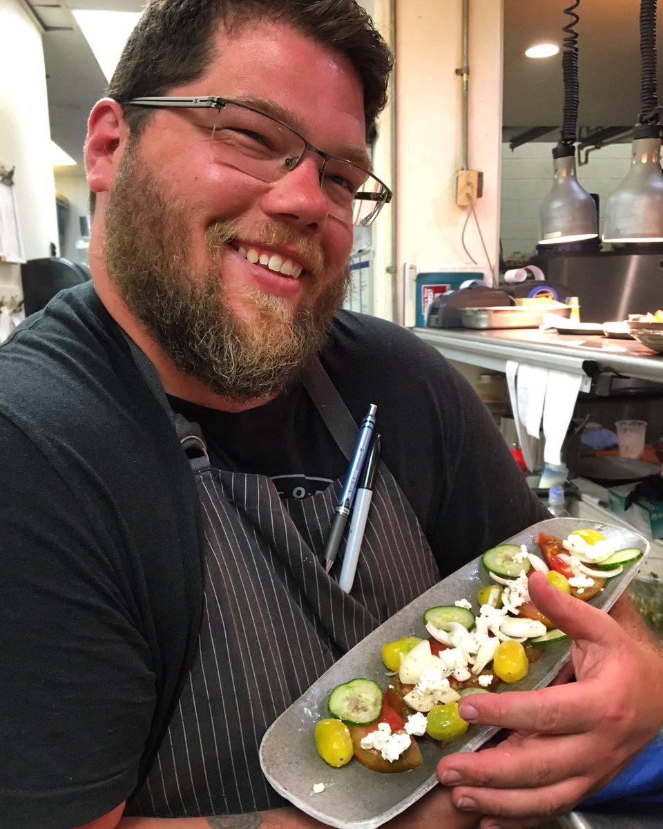 Chef Bobby is very proud of his new tomato salad! Heirloom and cherry tomatoes, cucumber, onion, white vinegar and goat cheese make up this awesome summer small plate. #supportlocal