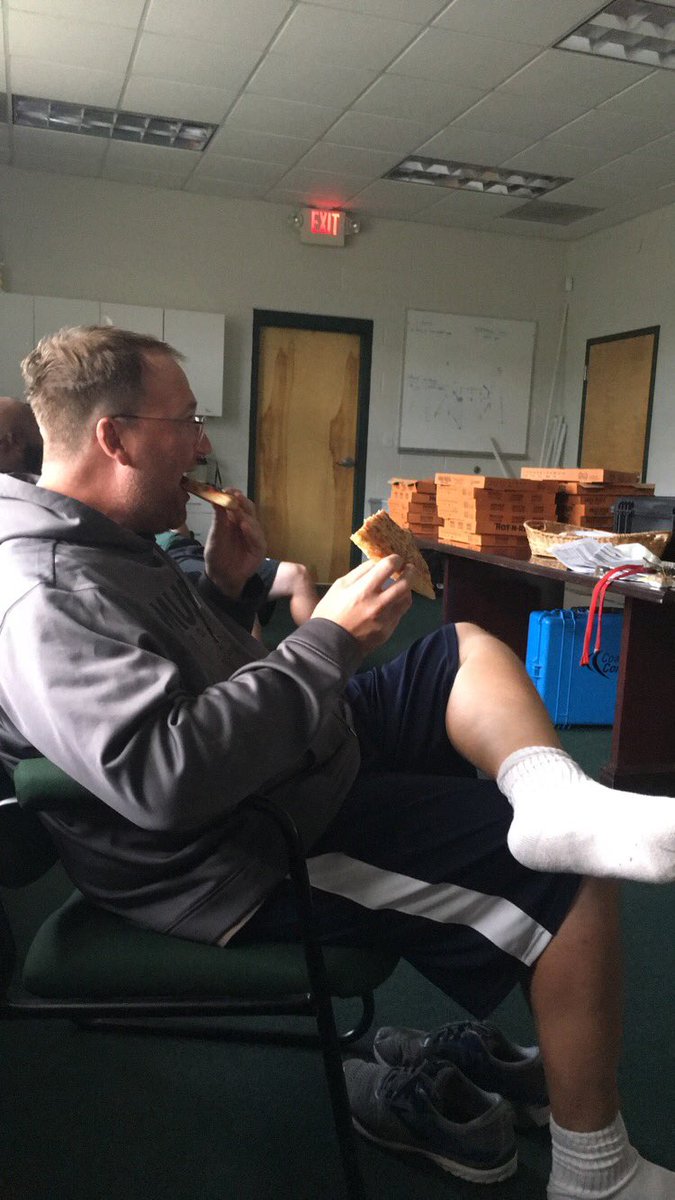 Coach_J_Parks's tweet photo. This is a picture of @coachhamilton70 eating his first 2 out of 60 slices of pizza in one sitting. #TweetingForClass #KN7390 https://t.co/1BLZNw0WWa