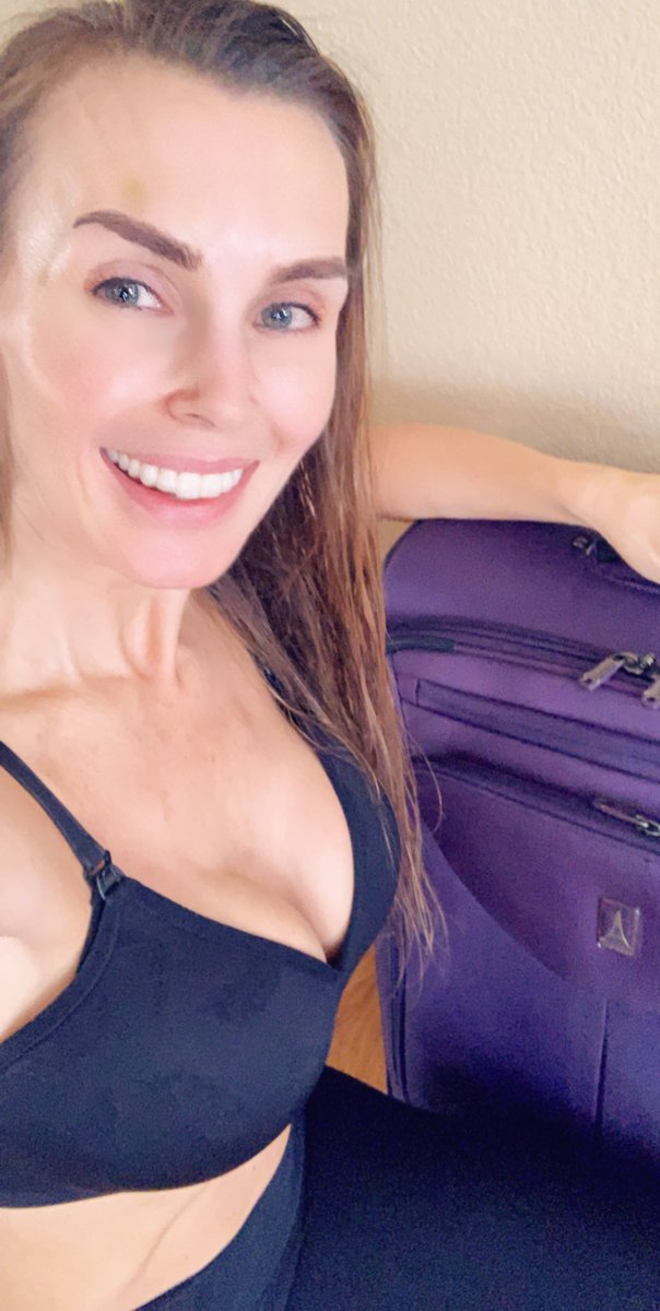 Tanya tate with suitcase.