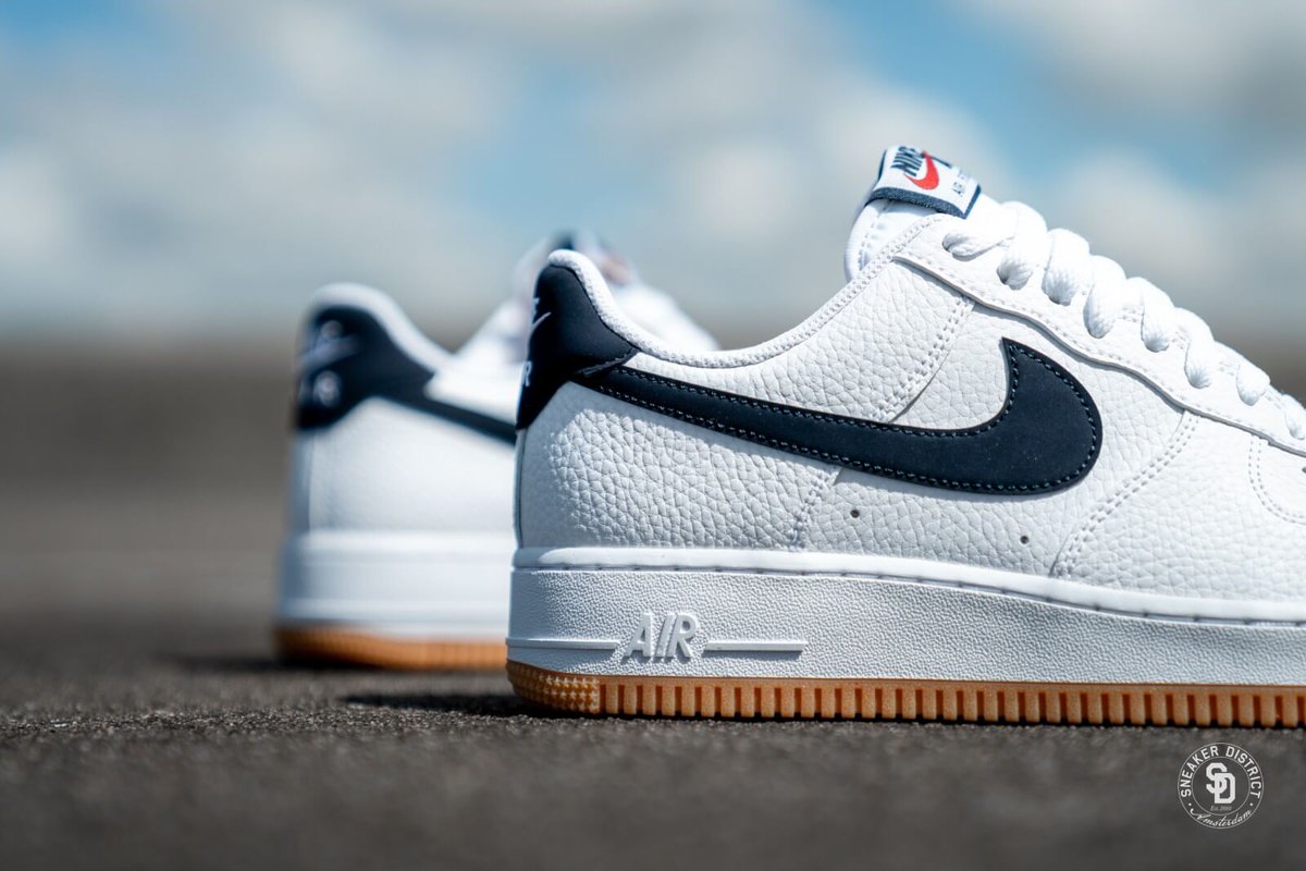 nike air force 1 sneakers with navy swoosh and gum sole