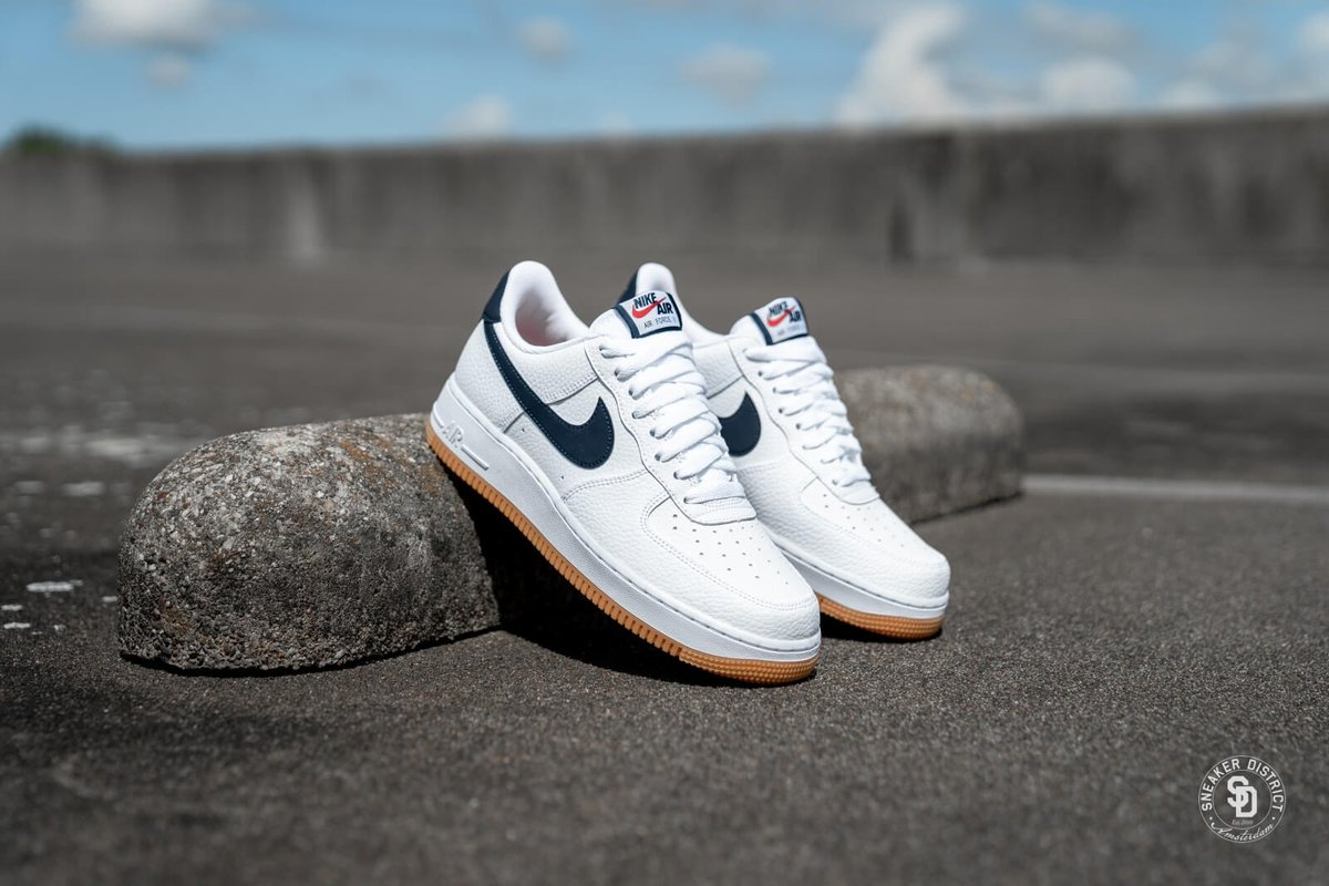 nike air force 1 sneakers with navy swoosh and gum sole