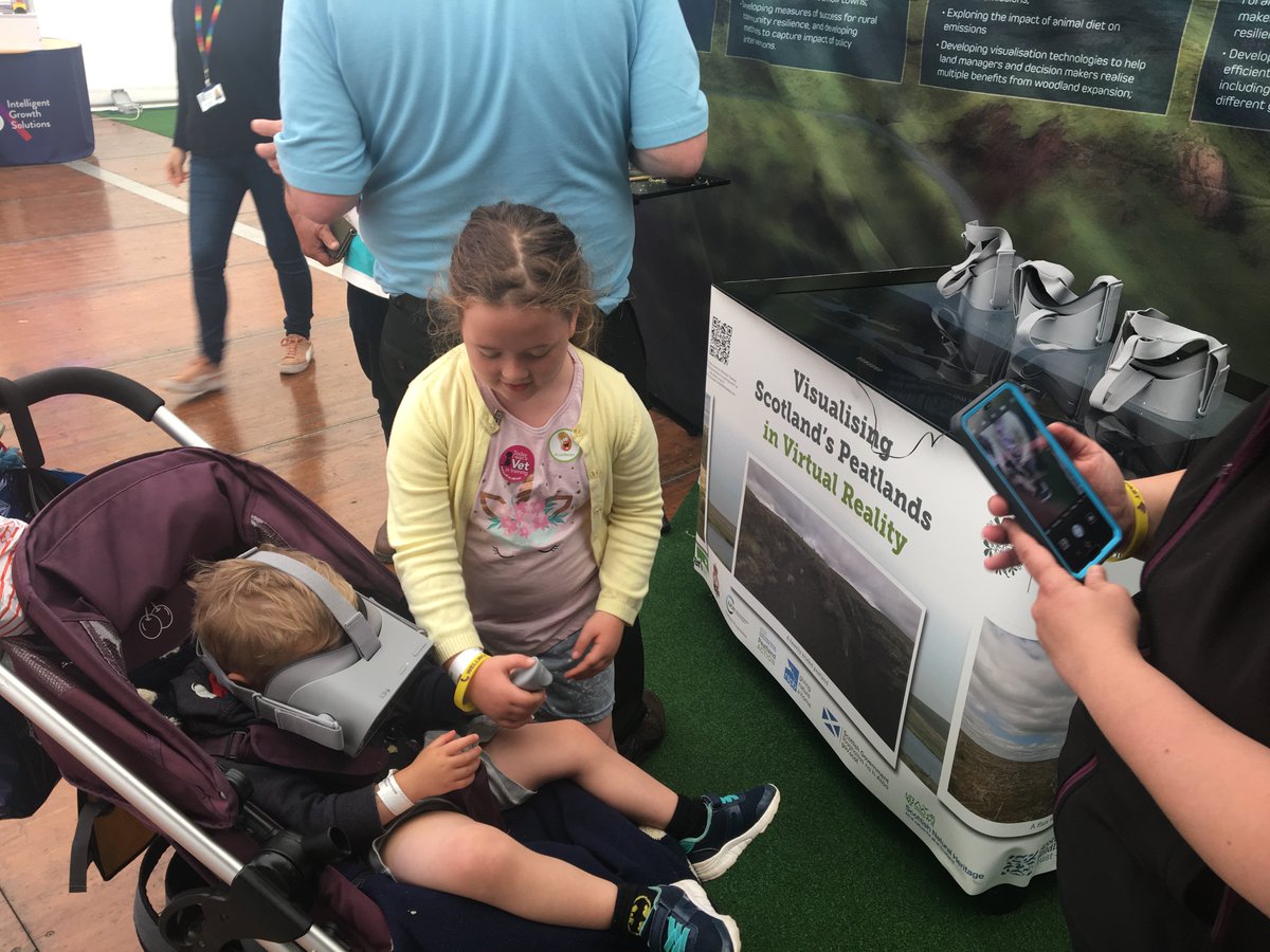 Peatland scientists start at all ages! A young Virtual Reality enthusiast checking out the benefits of peatland restoration at the <a href="/SEFARIscot/">SEFARI Gateway</a> Peatland stand, in the <a href="/JamesHuttonInst/">James Hutton Institute</a> marquee. #huttonatrhs