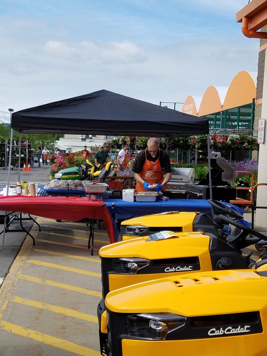 SoniaStocking's tweet photo. Hanging baskets are flying off the racks! Grilling for our associates and customers! #letsdothis #trendingorange @SupercuseDM https://t.co/pdnSyJwCGc