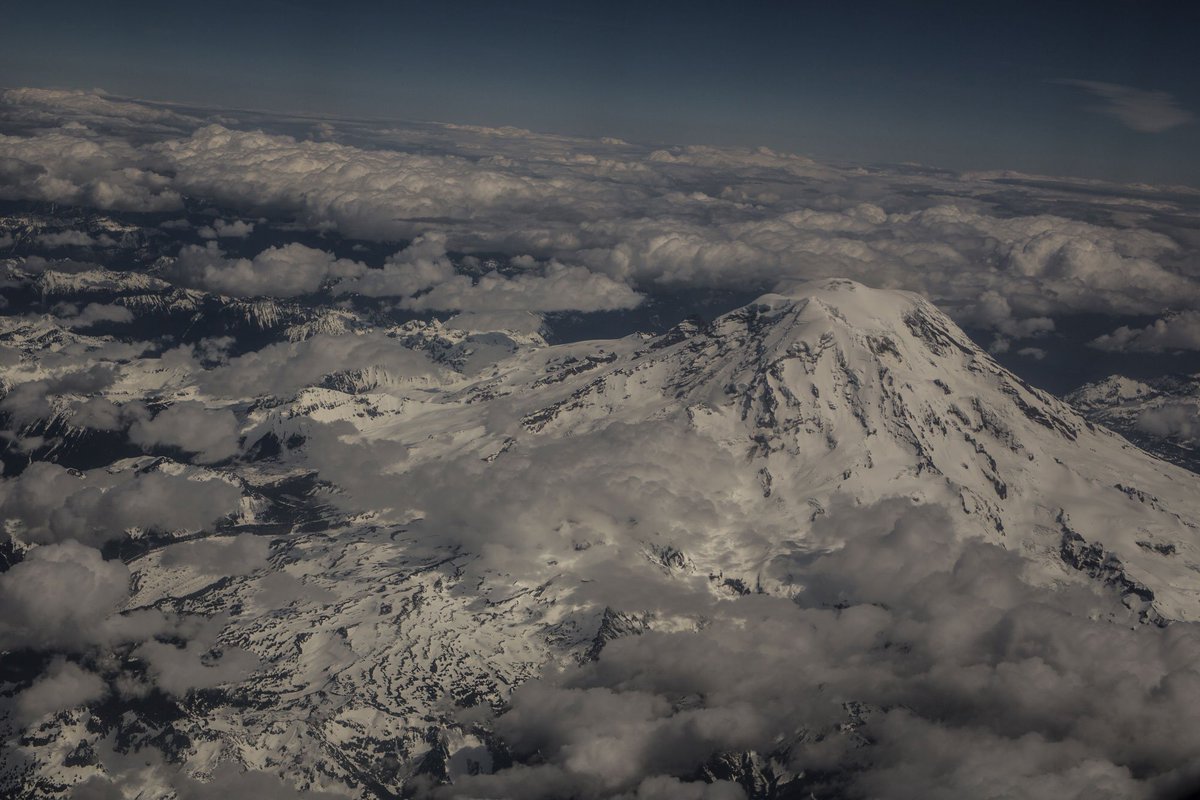 BlueChalkMedia's tweet photo. A majestic #MtRainier pokes through the clouds. Photo by @jamierafe. #washingtonstate #photography https://t.co/V3A5L4rrzo