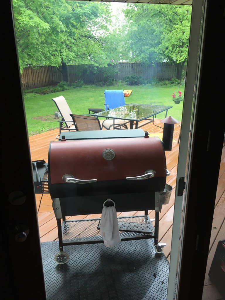 fightintriton's tweet photo. Love my overhang on the back patio #grill in rain #sunday funday #7pound brisket https://t.co/k1c27XTjEz