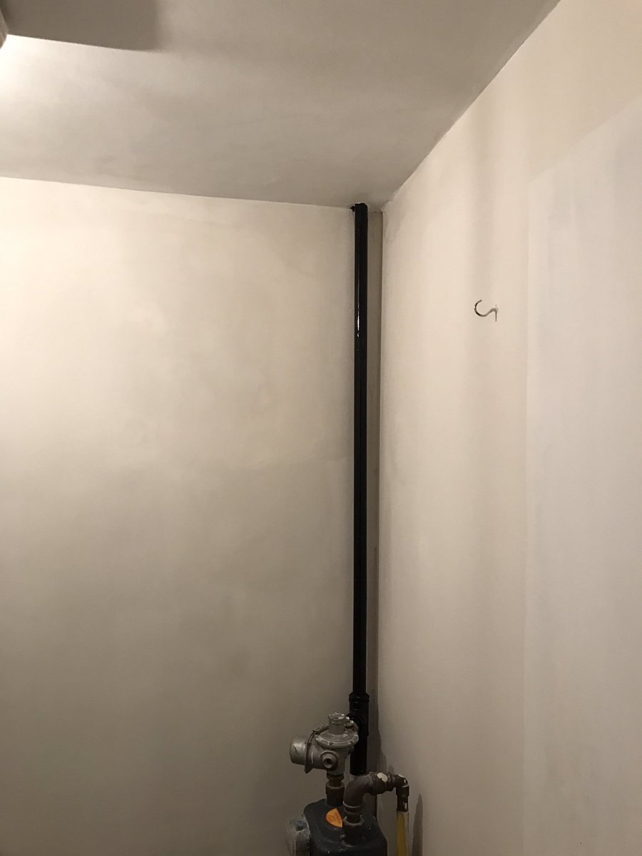 Quick before and after of water damaged property (picture looks patchy as paints still drying)