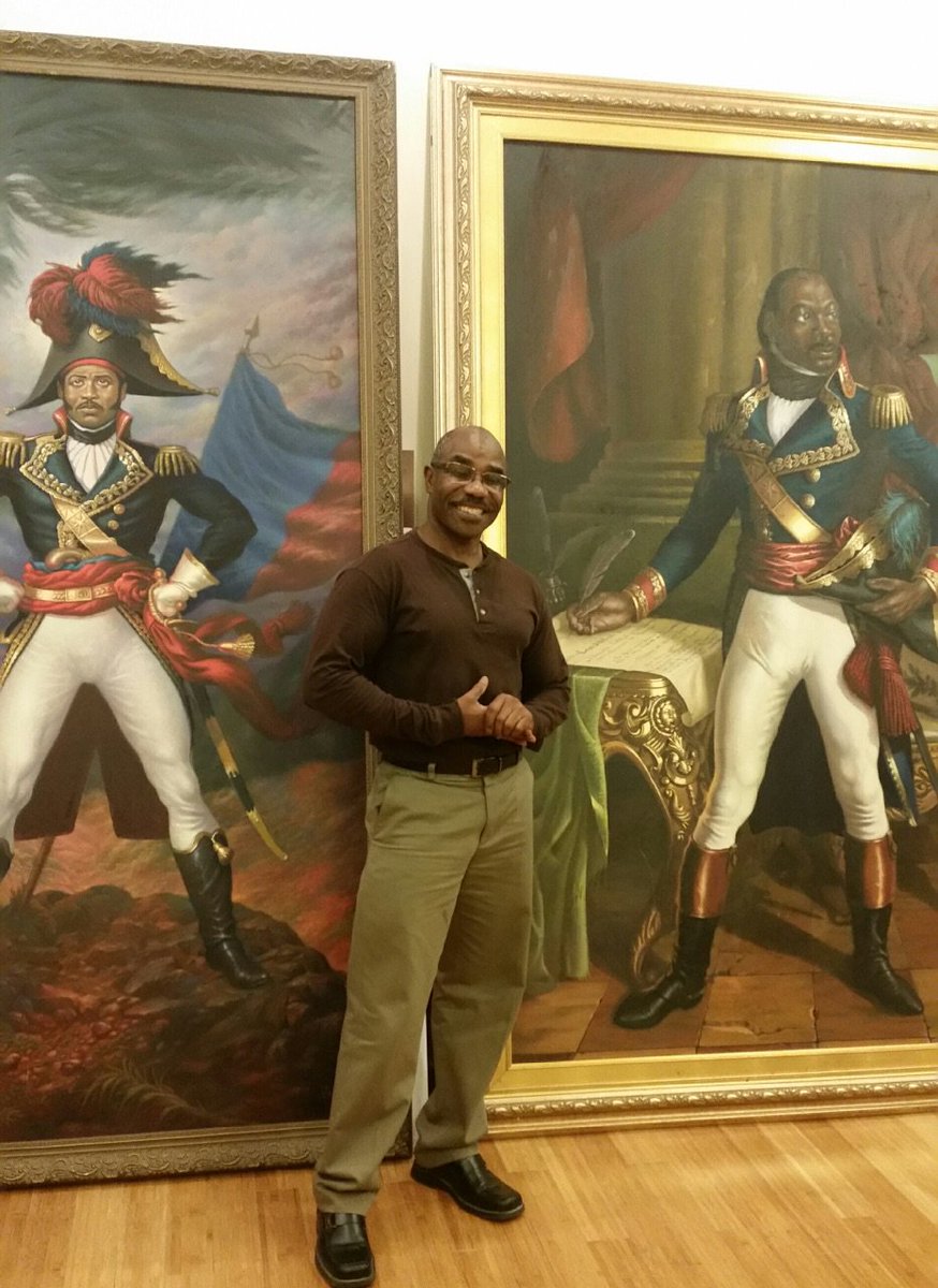 ArtsMattapan's tweet photo. NOLA-based artist, Ulrick Jean Pierre poses in front of his paintings (Dessalines and L'ouverture) restored after Katrina-flood damage. https://t.co/PPFFy3H2Lj