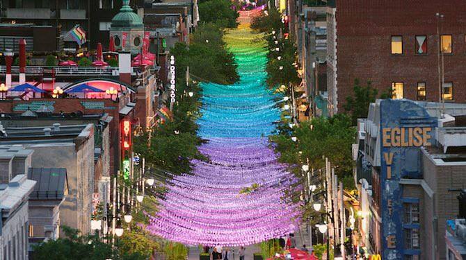 Aerial view of Montreal's gay village with rainbow garland handing over the street.