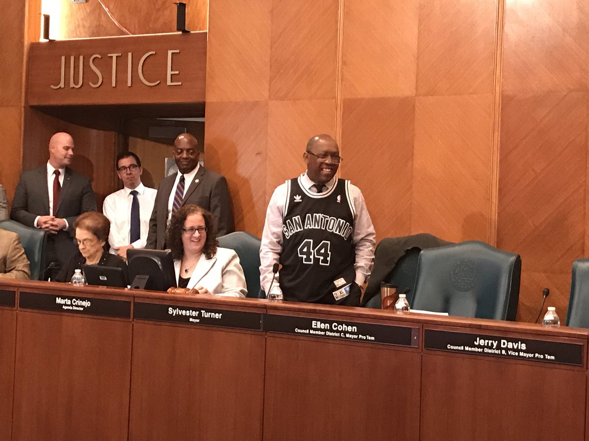 SylvesterTurner's tweet photo. In keeping good on my friendly wager w/ @IvyRTaylor, I wore my custom @spurs jersey to work today 😑😎. Next year @HoustonRockets next year... https://t.co/9trxgSmtL6