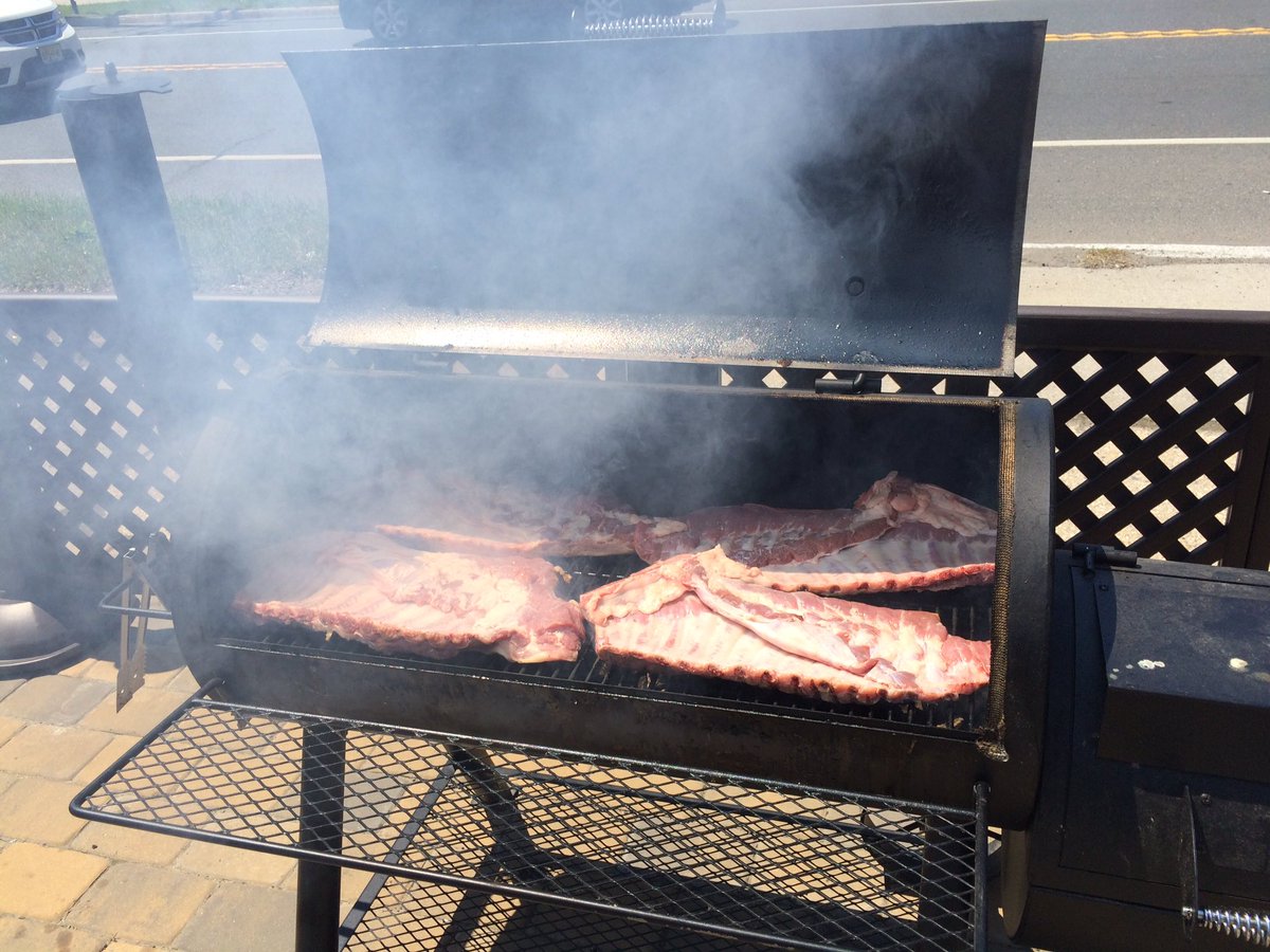 Smoking ribs <a href="/CircleBBQ/">Circle BBQ</a> #elizabethnj #kansascitystyle #collardgreens #macandcheese #bakedbeans #coleslaw #cornbread