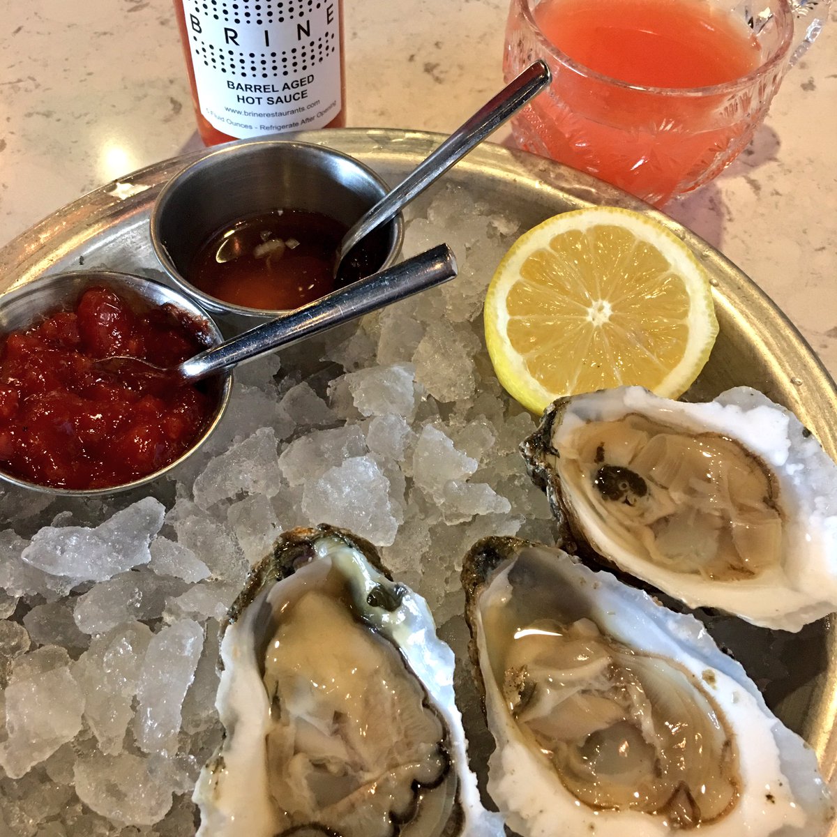 Michelin_DC's tweet photo. Time for #oysters at Brine. Don't forget the hot sauce...or the punch 🤛. https://t.co/CslgAqRszS