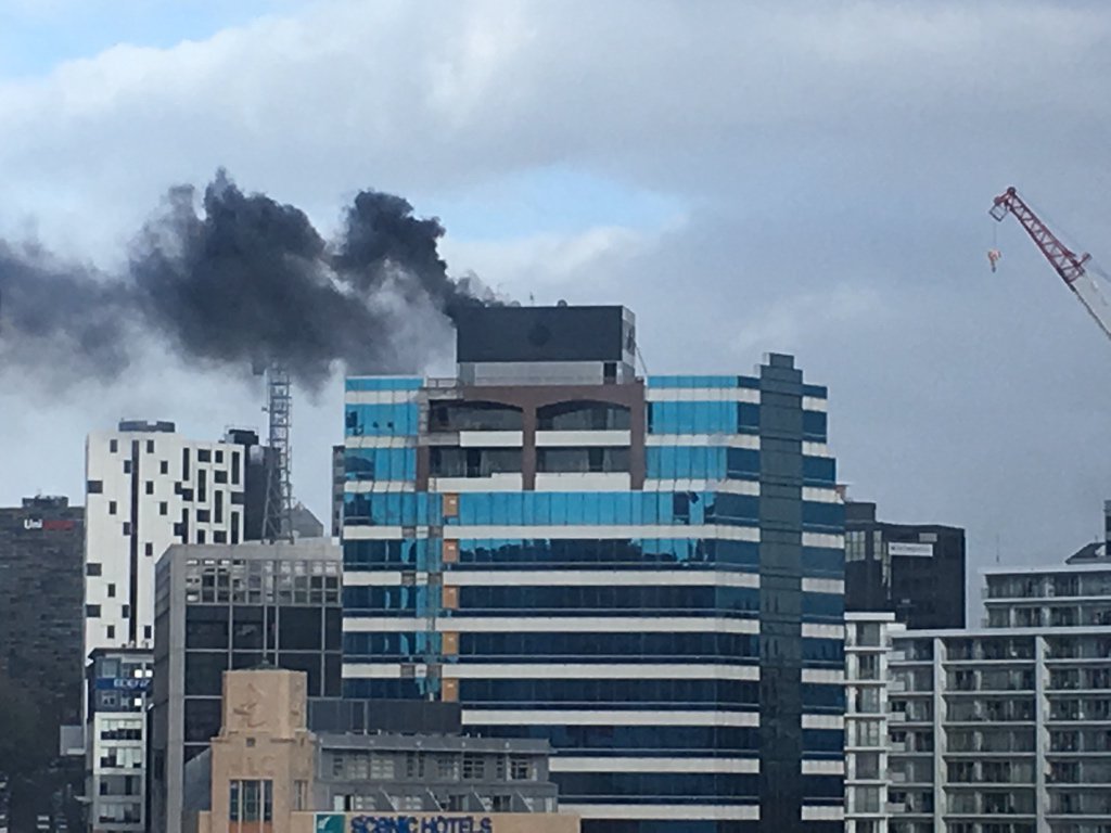 Jonnotie's tweet photo. @nzstuff Auckland. taken from floor 10 somewhere close by. You can see a ladder put up by firemen on the right. https://t.co/1p6wAYMig8