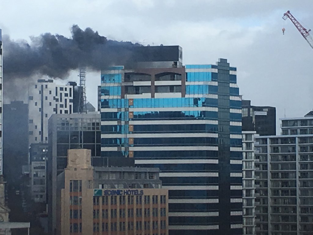 Jonnotie's tweet photo. @nzstuff Auckland. taken from floor 10 somewhere close by. You can see a ladder put up by firemen on the right. https://t.co/1p6wAYMig8
